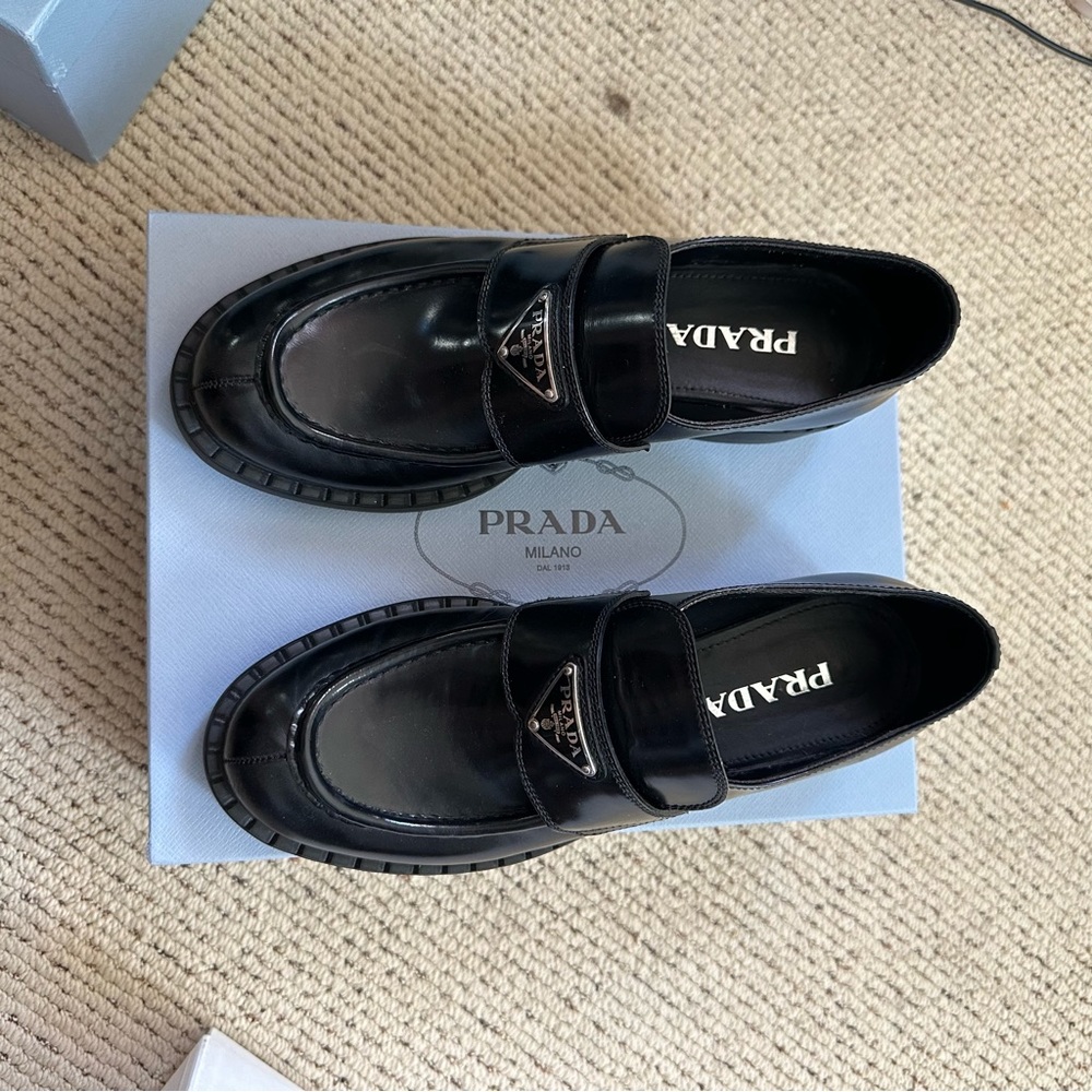 SOLD elsewhere. Prada NWOT Leather Triangle Logo Loafers size 40.5